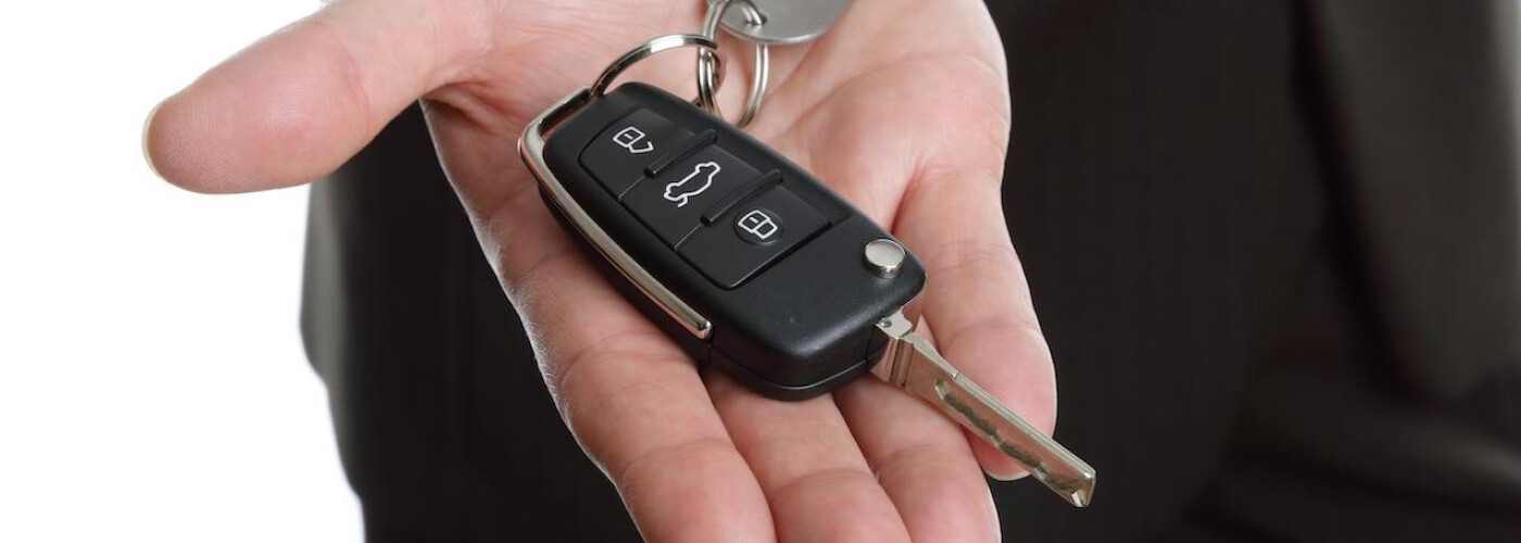 Man with a car key in his hand