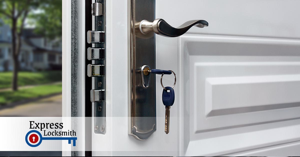 white door with a blue key in the door lock
