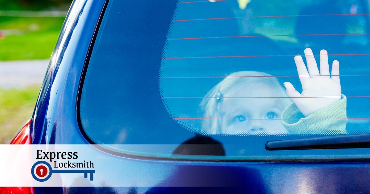 little girl with her hand on the rear windshield