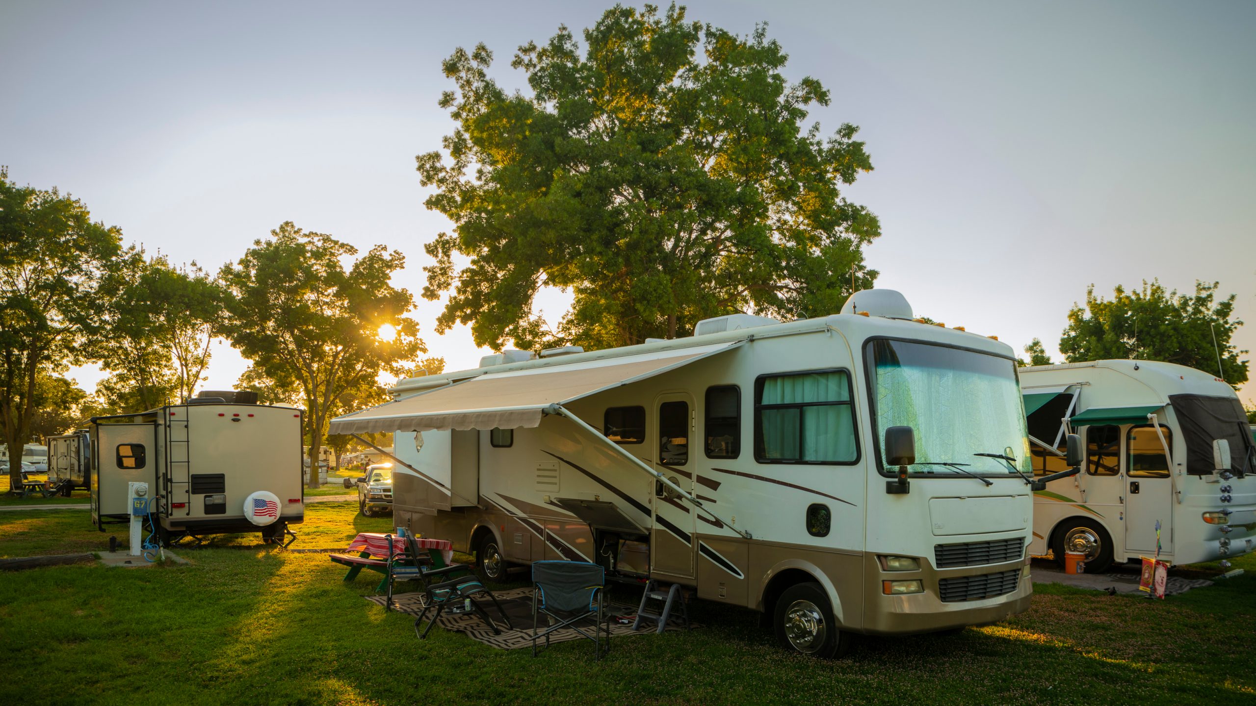 multiple parked RVs in a field