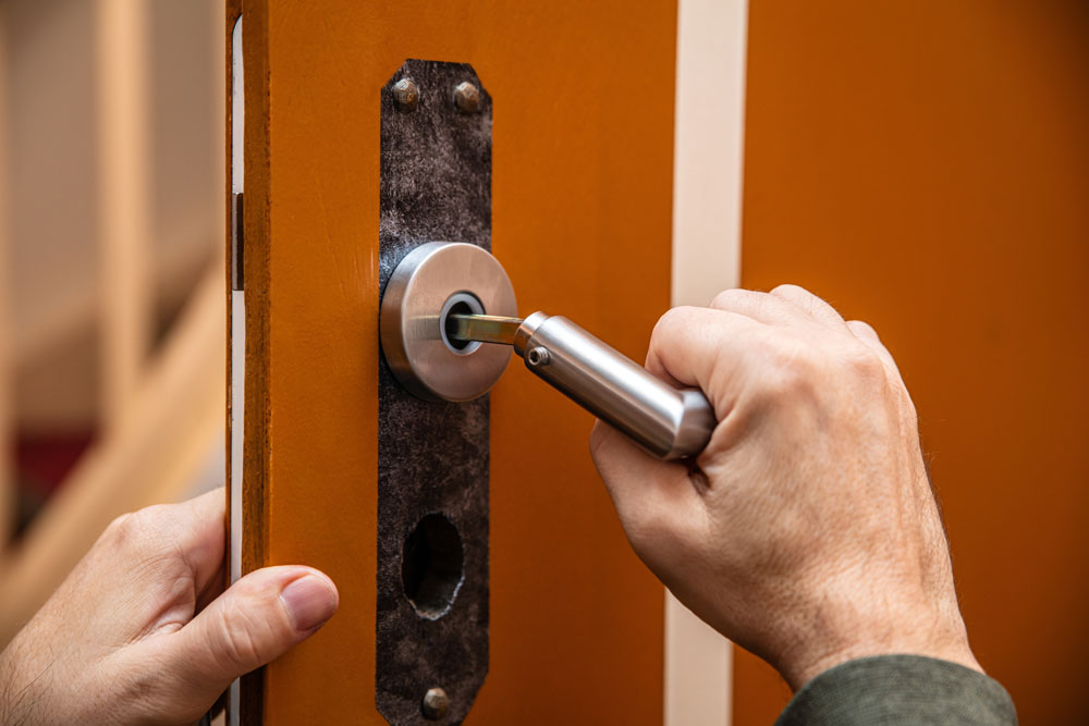Locksmith rekeying a door lock in Houston Texas